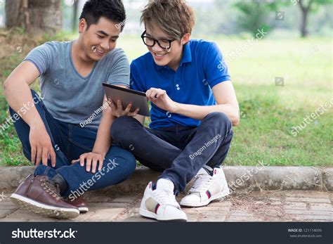 Friends hanging out stock photos and images. Best Friends Hanging Out Together Watching Stuff On The ...