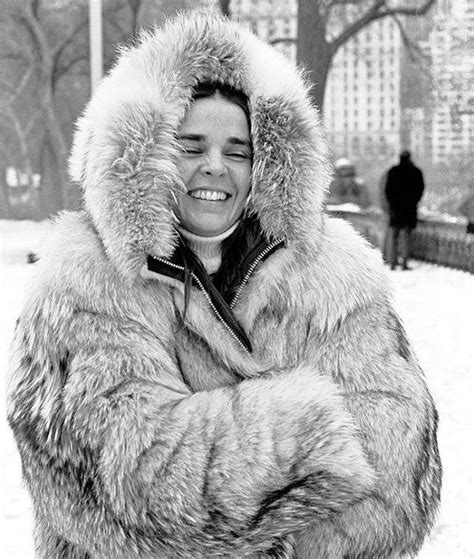 A Woman Wearing A Fur Coat In The Snow