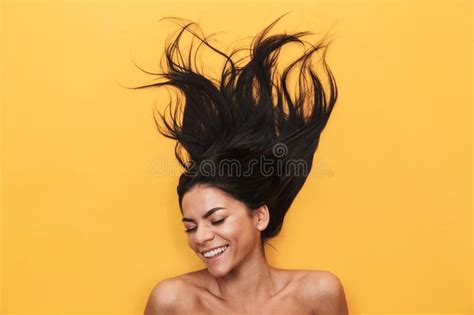 Pleased Happy Young Woman Lies Isolated On Yellow Background Healthy