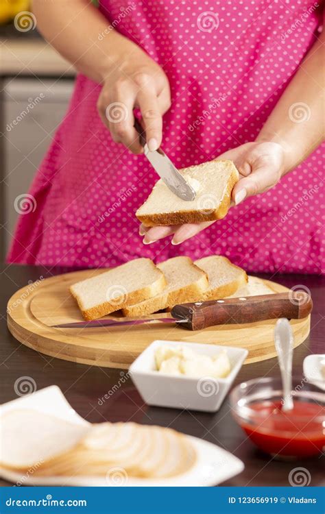 Woman Spreading Butter Over A Bread Slice Stock Image Image Of