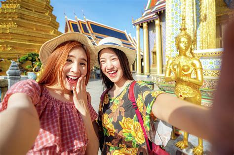 Two Asian Girlfriends Traveling And Selfie By Camera In Smartpho