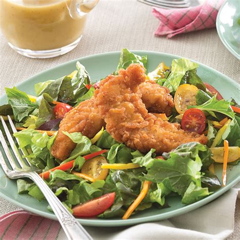 On a plate, arrange your greens, salad ingredients and top with fried chicken strips and salad dressing. Easy Chicken Dishes - Paula Deen Magazine