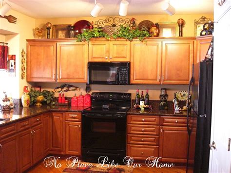 Gain extra storage space by stacking baskets on top. decorating above kitchen cabinets tuscany | Here's a ...