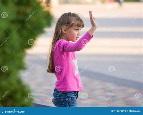 Six Year Old Girl Waving His Hand Stock Photo Image Of Teenager Hair