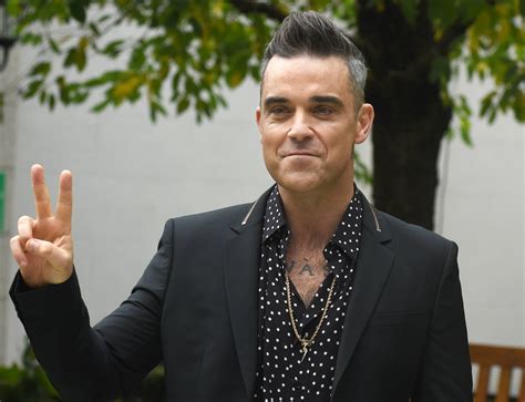 Robbie Williams SLAMMED online for asking transgender contestant his ...