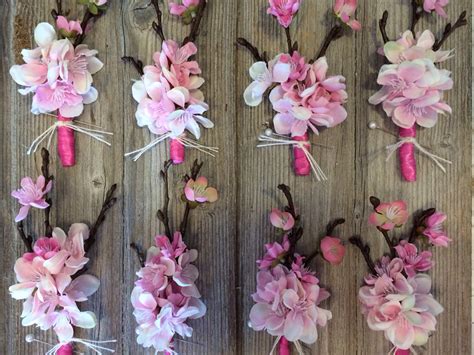 Our eyes are fixated on a breathtaking wreath of blooming white branches as the ceremony arch created. Cherry blossom corsages | Cherry blossom wedding, Cherry ...