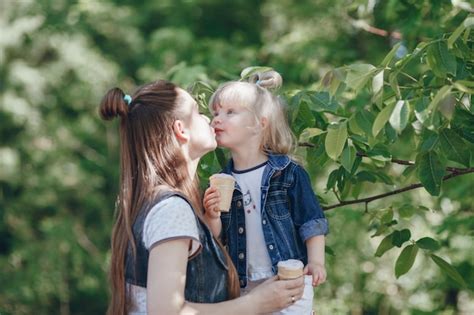 Free Photo Mother And Daughter Kissing In The Mouth