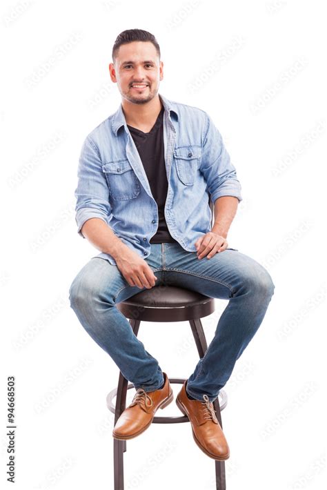 Good Looking Man Sitting In A Chair Stock Photo Adobe Stock