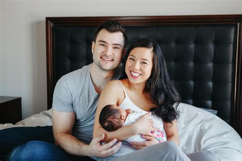 Chinese Asian Mother And Caucasian Father With Mixed Race Newborn
