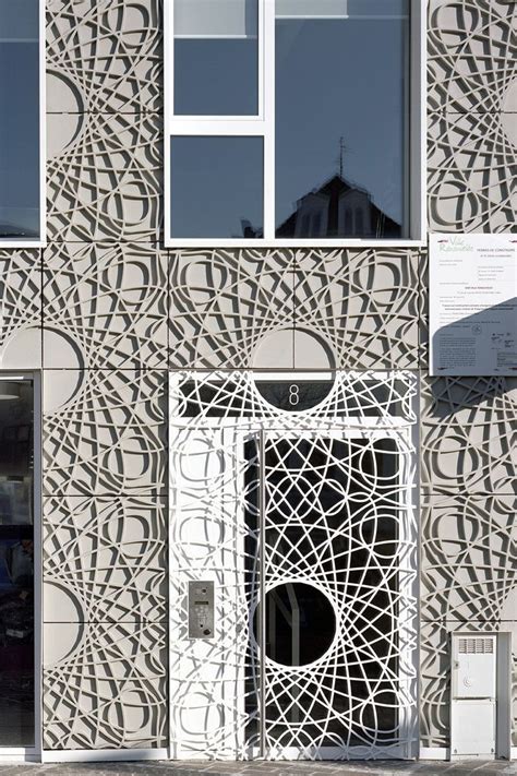 This Building Facade Is Made Up Of Decorative Concrete Panels Inspired