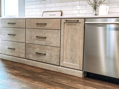 People nowadays are learning that home decor is not about keeping up with the jones', it is about building a space that is an extension of yourself and all that you love. Modern Farmhouse Kitchen With White Subway Tile, Painted Upper Cabinets, and Wood Stain on base ...