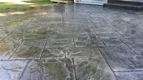 Stamped wooden plank concrete patio boardwalk stamp patterns resemble real wooden planks and create the perfect durable patio surface that will never rot from excessive exposure. Ashlar Slate Stamped Patio St Peters | Shamrock Concrete