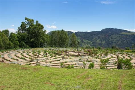 Beautiful Concrete Maze Surrounded By Grass Covered Fields And Trees