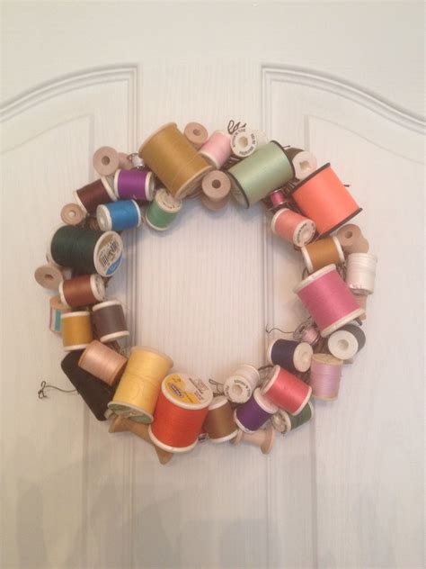 Glue Old Thread Spools On A Grapevine Wreath And Fill In