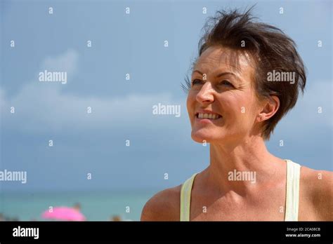Mature Beautiful Tourist Woman At The Beach Outdoors Stock Photo Alamy