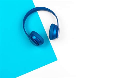 Turquoise Headphones A Colored Background Photo Premium Download