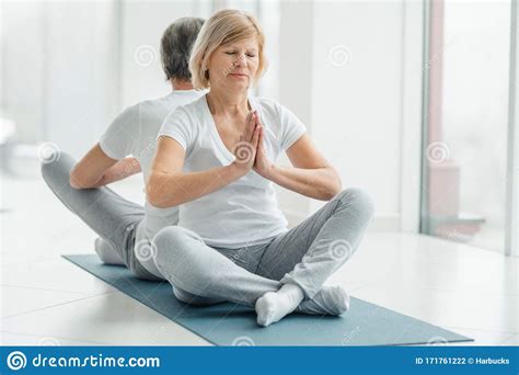Healthy Lifestyle And Wellness Concept Senior Couple Doing Yoga