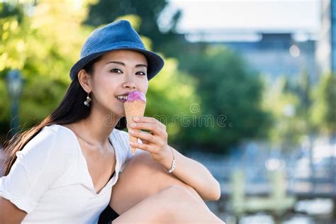 Young Japanese Woman Eating Ice Cream Outdoors Stock Image Image Of