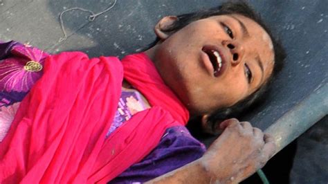 survivor pulled from rubble in bangladesh