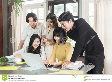 Group Of Young Asian Students High School Working Report Together In