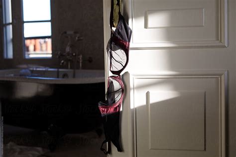 Black Bra Hanging On A Bathroom Door By Stocksy Contributor Helen Rushbrook Stocksy