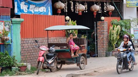 Little Asian Girl Plays In A Motor Rickshaw A Scooter Rides Along The Road Editorial