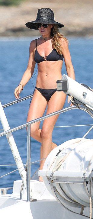Abbey Clancy Shows Off Her Incredibly Taut Abs In A Black Bikini