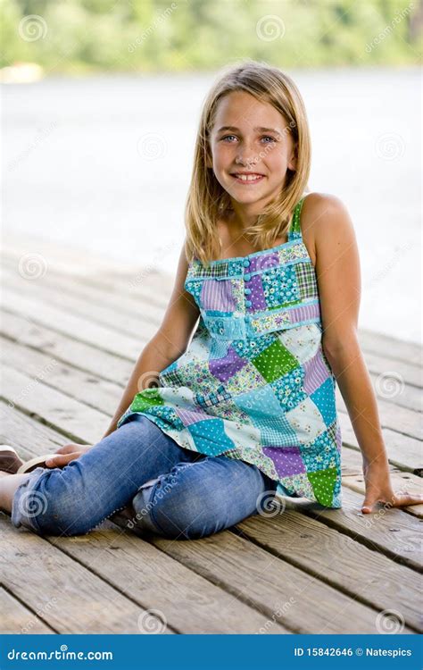 Young Tween Girl Sitting On A Pier Stock Photo Image Of Childhood