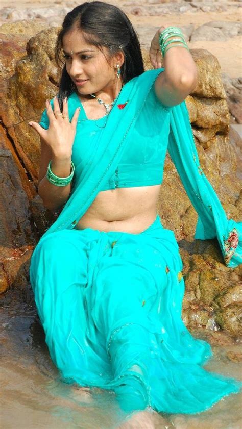 Her makeup was on point with some mesmerizing dark blue eye shadow. Hot Telugu sweaty wet saree actress showing navel | Indian actress hot pics, Gorgeous women hot ...