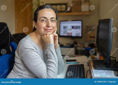 Middle Aged Pretty Woman With Glasses Looking To The Camera And Smiling Stock Image Image Of
