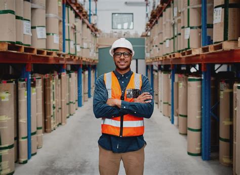 Successful Warehouse Supervisor Smiling And Working While Holding