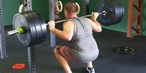 Here's How to Squat with Proper Form, Using a Barbell