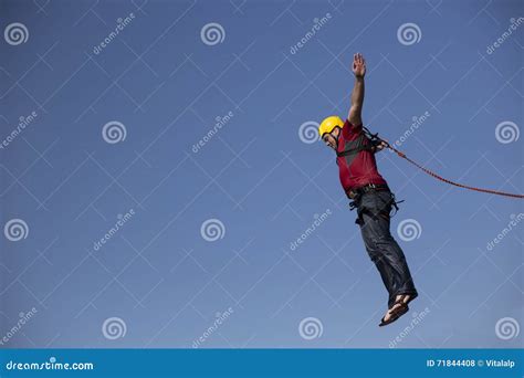 Man Jumping Off A Cliff Stock Photo Image Of Person 71844408