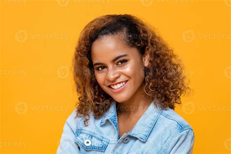 Close Up Portrait Of Happy Young Beautiful African American Woman Smiling While Looking At