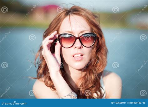 Redhead Girl In Sunglasses Close Up Emotions Young Redhead Girl Relaxing In Sunglasses Woman