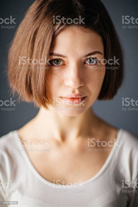 Close Up Portrait Of Young Beautiful Woman With Curious Facial