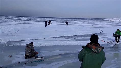 Wave Rolls Under A Frozen Lake Forcing Ice Fishers To Sprint To Safety