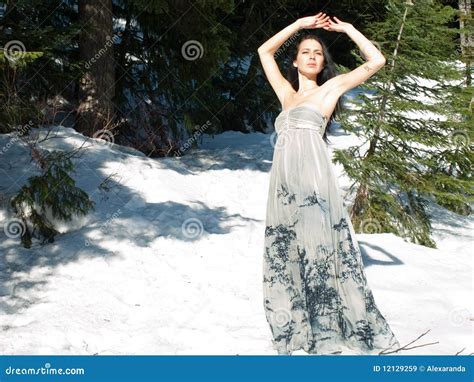 Beautiful Woman With Airy Dress Posing In The Snow Royalty Free Stock