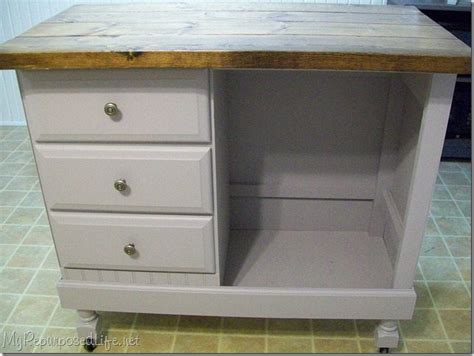 An old sewing machine base married to a fabulous old refrigerator drawer makes an awesome planter! DIY Kitchen Island - My Repurposed Life™