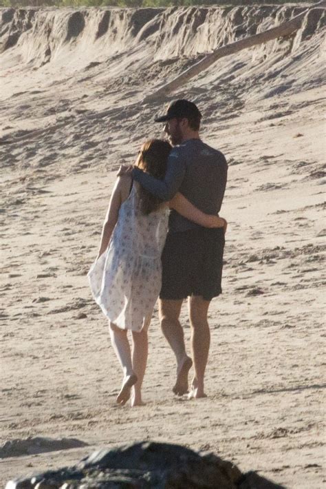 Dakota Johnson And Chris Martin Show Sweet Pda During Romantic Malibu Beach Stroll See The