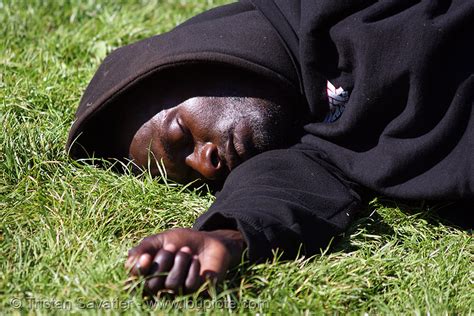 Black Man Sleeping On Grass