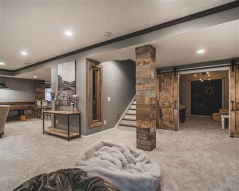 The popularity of gray paint in the home has extended below ground, where the subtle shade brings sophistication to any basement den, living room, or home office. Basement Design Ideas, Renovations & Photos with Grey Walls