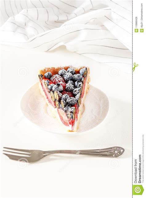 Serving Homemade Mix Berry Tart With Fresh Raspberries Blueberries