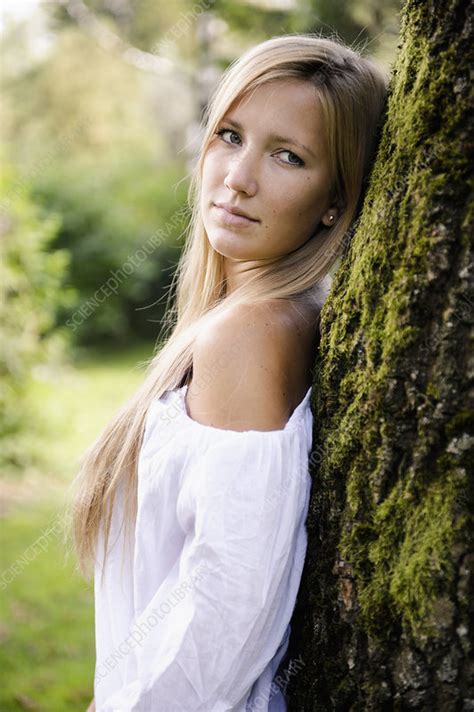 Woman Leaning Against Tree Outdoors Stock Image F0057396 Science