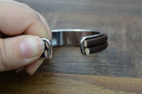 Diy cuff bracelets tutorial, easy craft, make easy cuff bracelet from a belt, leather cuff bracelet, handmade cuff bracelet, leather belt cuff bracelet. The Three-Minute DIY Leather Bracelet Cuff - Happy Hour Projects