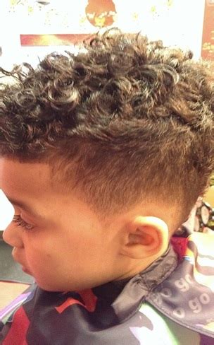 If you have curly or wavy hair with enough texture, you can a very cool haircut that is quite popular among young men and boys these days. Toddler Boy with Curly Hair: Top 10 Haircuts + Maintenance - Child Insider