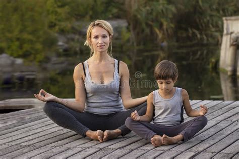 Mother And Son Exercising Yoga Pose Stock Photo Image Of Mother Lifestyle