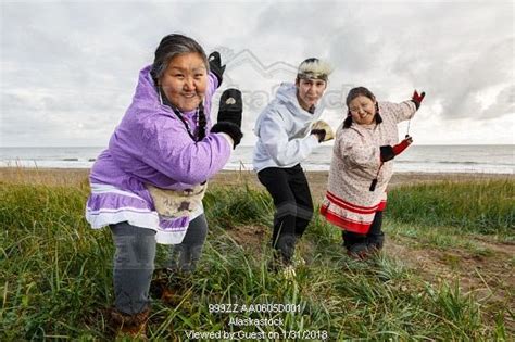 Photo Of Yupik Eskimo Women And Man Wearing Traditional Dress Dancing Outdoors On Bering Sea
