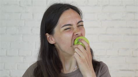 Female With Braces On Teeth Eating Green Stock Footage Sbv 325417814 Storyblocks