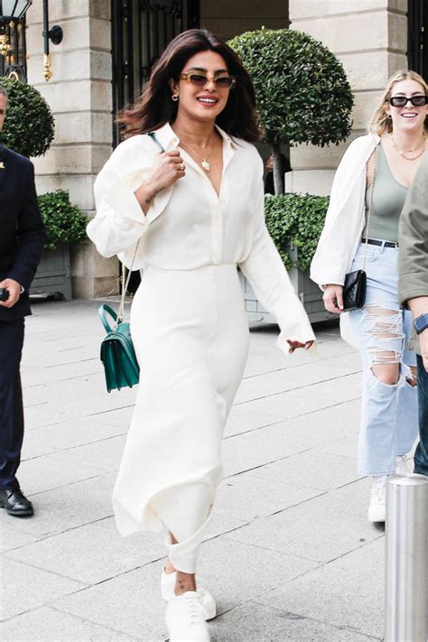 Priyanka Chopra Puts Trendy Finish On Thigh High Slit Skirt And Breezy Blouse With White Sneakers